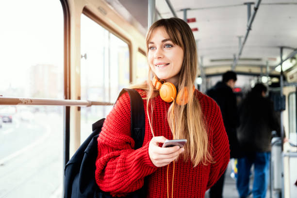 istock Young woman riding in public transportation 1072497312