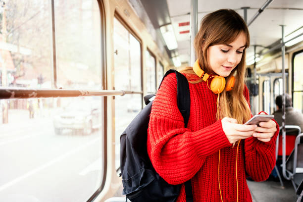 istock Young woman riding in public transportation 1072497508