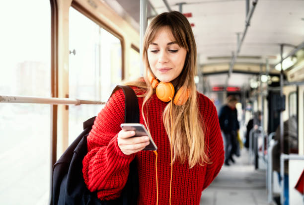istock Young woman riding in public transportation 1072497840