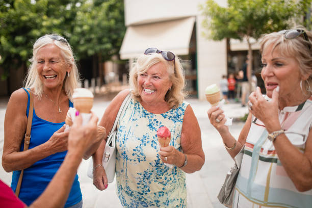 istock Senior Women Enjoying Ice Cream 1072497882