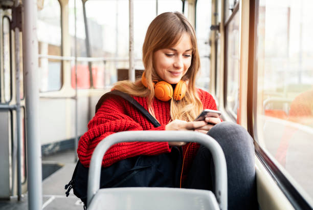 istock Young woman riding in public transportation 1072498168