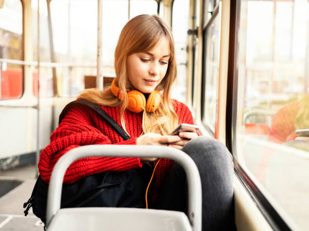 istock Young woman riding in public transportation 1072498176
