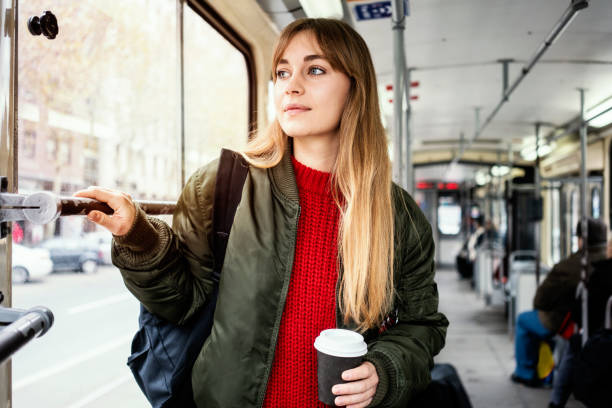 istock Young woman riding in public transportation 1072498486