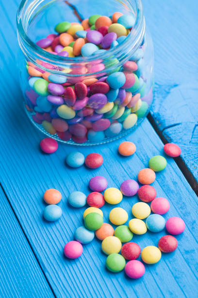 colorful chocolate candies - candy coated imagens e fotografias de stock