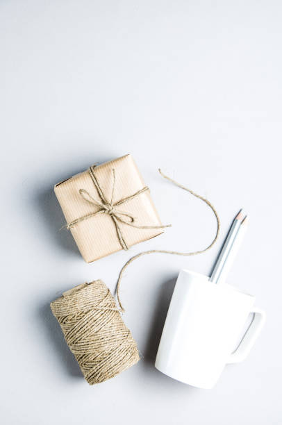 istock Clew of rope and gift on a light background. Place for text 1072505694
