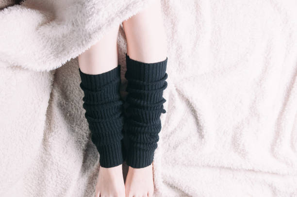 istock High black socks on women's legs 1072505766