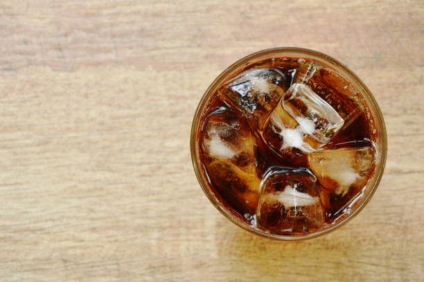 istock cola on ice in glass 1072507510