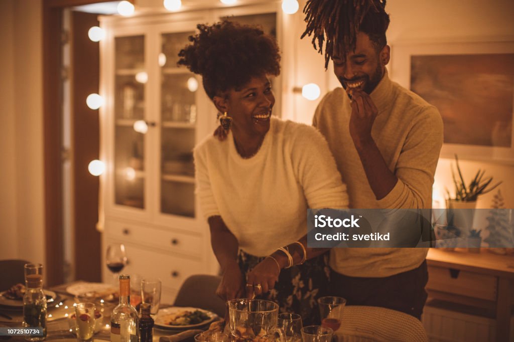 New year couple Couple organize new year party, they preparing dinner table for party Couple - Relationship Stock Photo