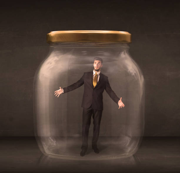 istock Businessman shut into a glass jar concept 1072515834
