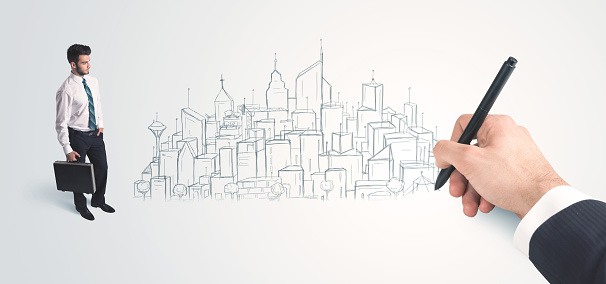 Businessman looking at hand drawn city on wall concept on background