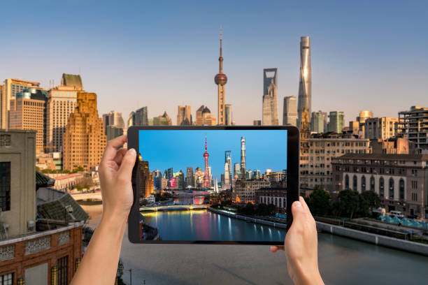 istock Looking shanghai skyline from the screen of the electronic device 1072517494