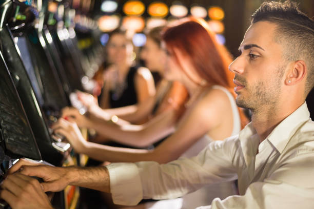 istock Playing Casino Slot Machines 1072519210