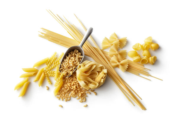 italienische küche: auswahl an pasta, isolated on white background - pasta directly above fusilli food stock-fotos und bilder