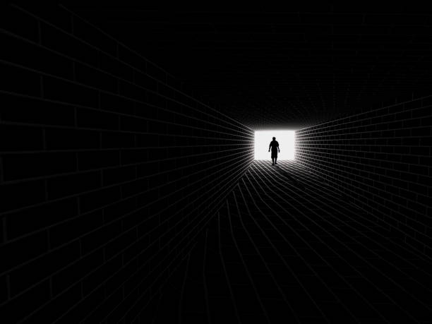 istock silhouette in a subway tunnel. Light at End of Tunnel , 3D rendering 1072523430