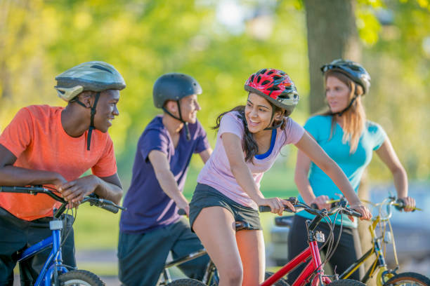 istock Friends cycling in the park 1072525782