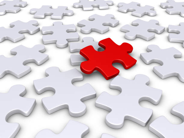 istock Many white puzzle pieces and one red 1072529274