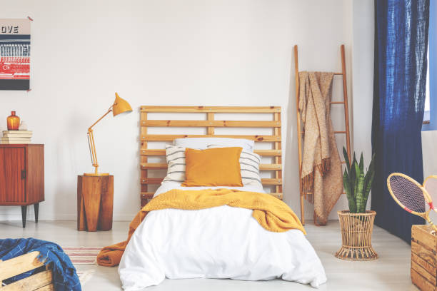 istock Retro bedroom interior designed for kid, real photo with copy space on the empty white wall 1072529462