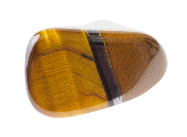 istock tumbled tiger's eye (tiger-eye) gemstone on white 1072531378