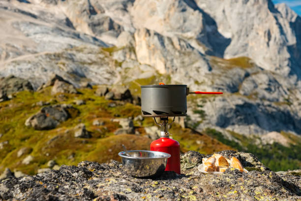 istock Tourist equipment and tools: camping gas on mountain background 1072532462