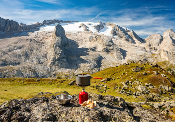 istock Tourist equipment and tools: camping gas on mountain background 1072532596