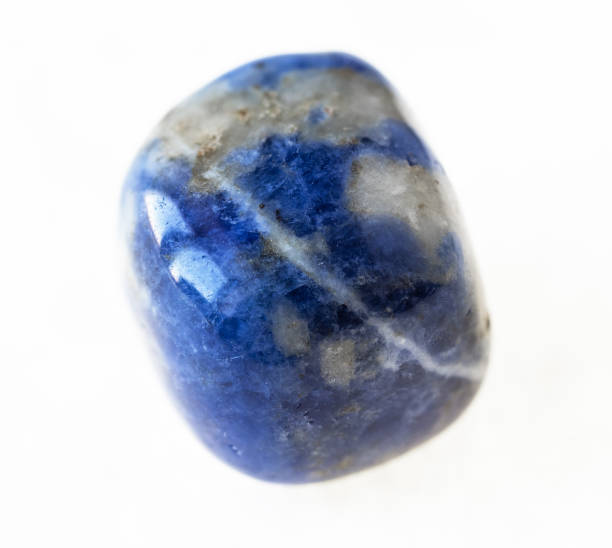 istock polished blue Sodalite stone on white 1072532628