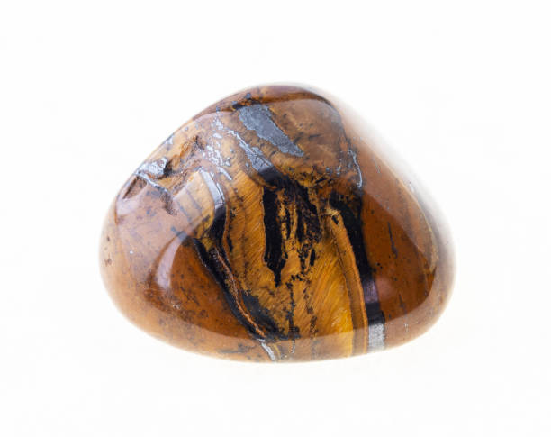 istock polished tiger eye (tiger-eye) gem stone on white 1072532718