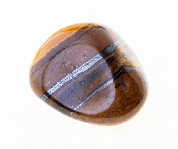 istock tumbled tiger's eye (tiger-eye) gem stone on white 1072532732