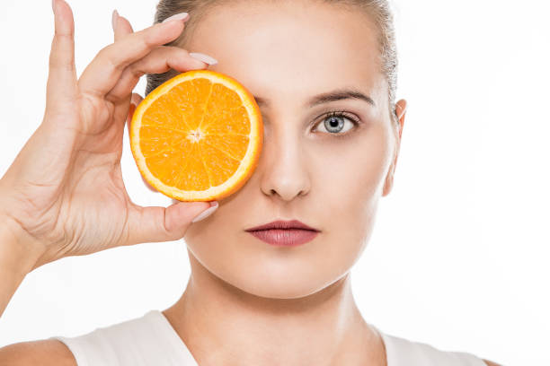 istock Woman portrait with a citrus fruit 1072534956