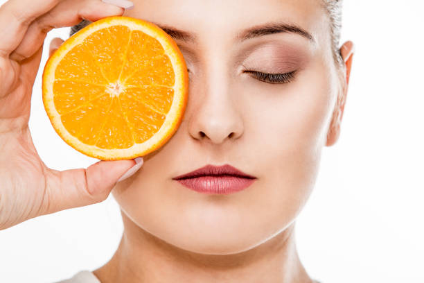 istock Woman portrait with a citrus fruit 1072534966