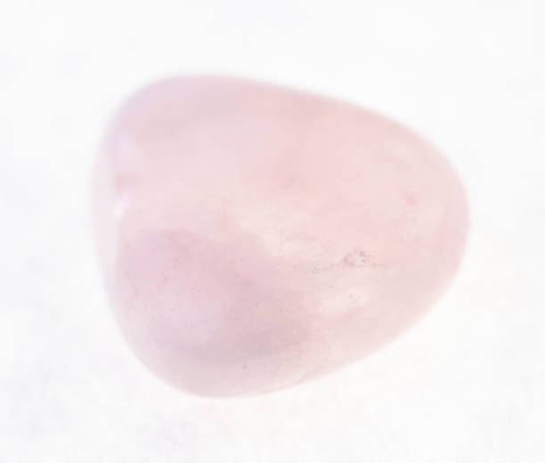 istock tumbled pink (rose) quartz gemstone on white 1072535738