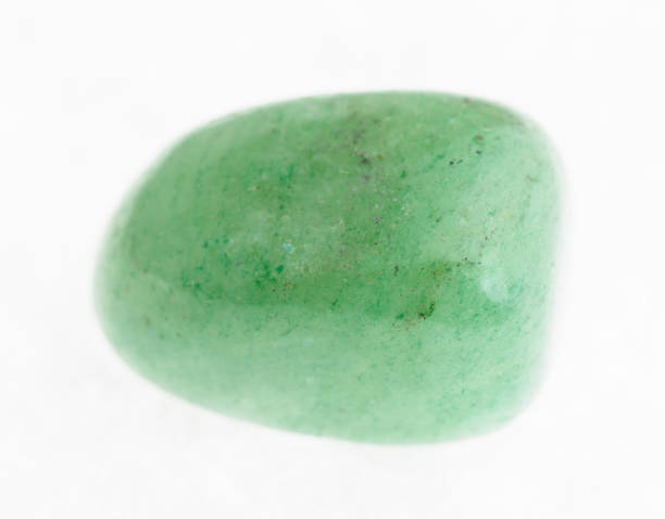 istock tumbled green Aventurine gem on white 1072536006