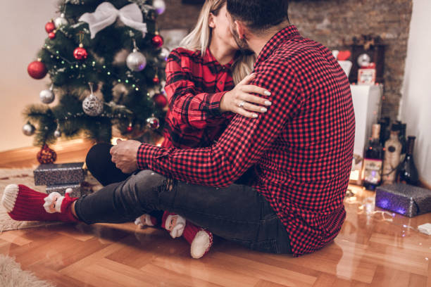 istock Lovely couple and Christmas tree 1072539668