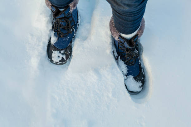 istock Woman's feet in snow boots in deep snow. Iceland 1072540498
