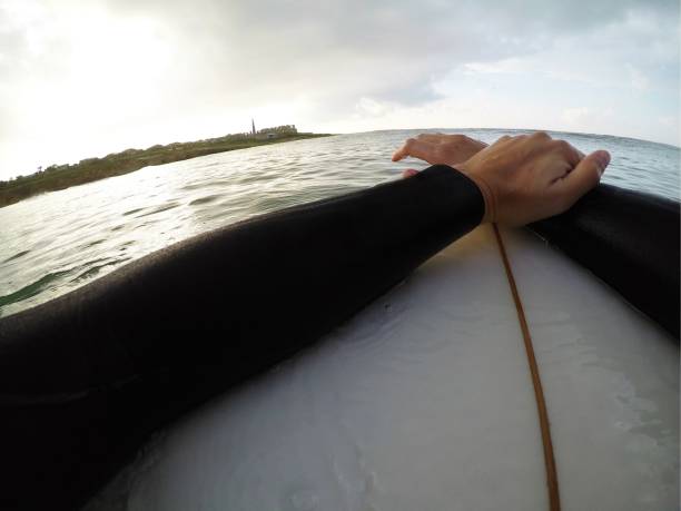istock Surfer chilling on surfboard and looking at the wiev 1072554884