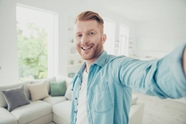 istock Online streamer or social influencer make selfie on front camera 1072555148