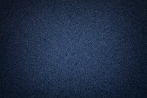 Textura antigua fondo de papel azul marino, closeup. Estructura de cartón denso. photo