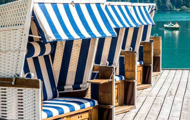 hooded beach chairs at a lake
