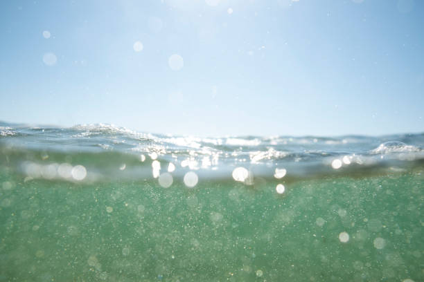 istock Above and below the sea surface at Porthcurno Beach, Cornwall on a bright sunny September day. 1072558544