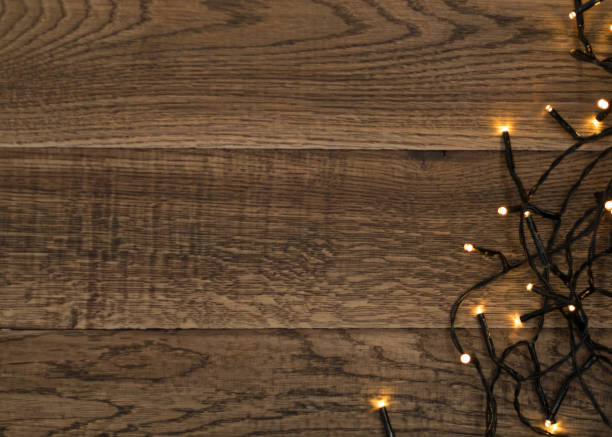 istock Christmas Light or Garland Lights on Wood Background 1072559294