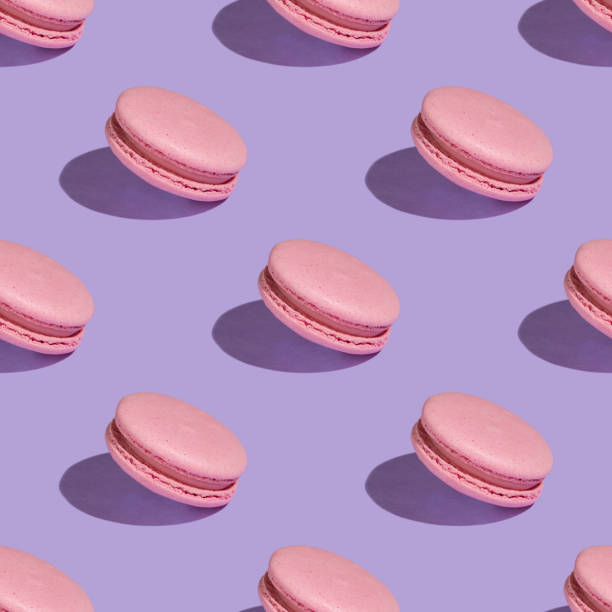 istock Seamless pattern of delicious pink macaroons. 1072559456