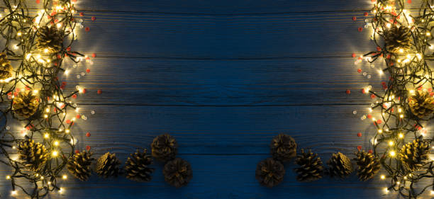 istock Christmas Light or Garland Lights on Wood Background 1072559842