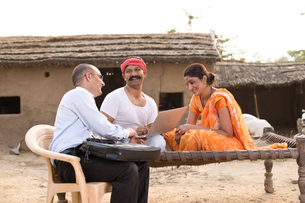 istock Real estate agent with client at village 1072567318