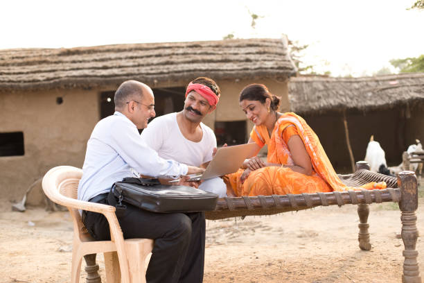istock Real estate agent with client at village 1072567502