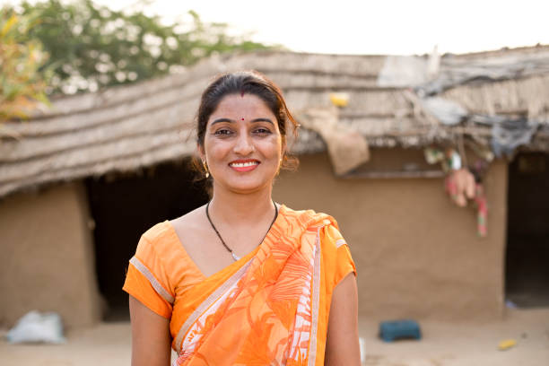 istock Indian woman standing at village 1072573642