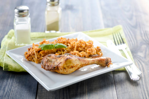 istock roasted chicken with rice and onions 1072574110