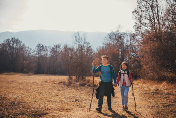 istock Brother and sister hiking 1072574290