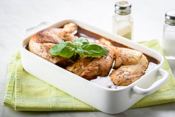 istock roasted chicken with rice and onions 1072574532