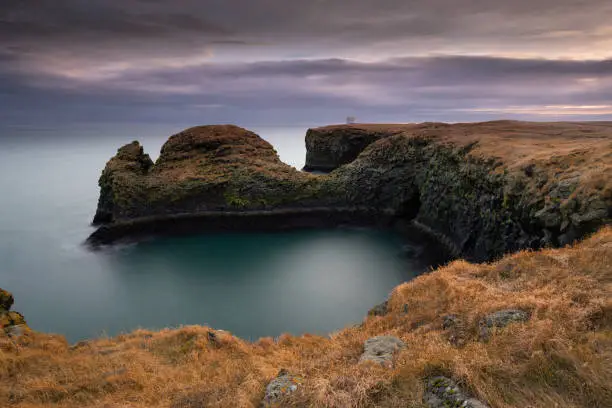 Photo of Volcanic cliffs and basalt rocks in Arnarstapi, Iceland