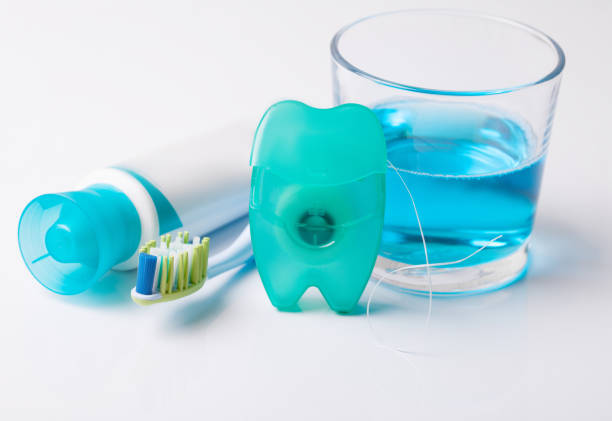 istock Tools for dental care: orthodontic brush, floss, toothpaste. Invisible dental aligners modern tooth brackets transparent braces to straighten teeth in cosmetic dentistry and orthodontics 1072577968