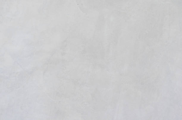 istock gray concrete background texture clean stucco fine grain cement wall clear and smooth white polished. 1072579400